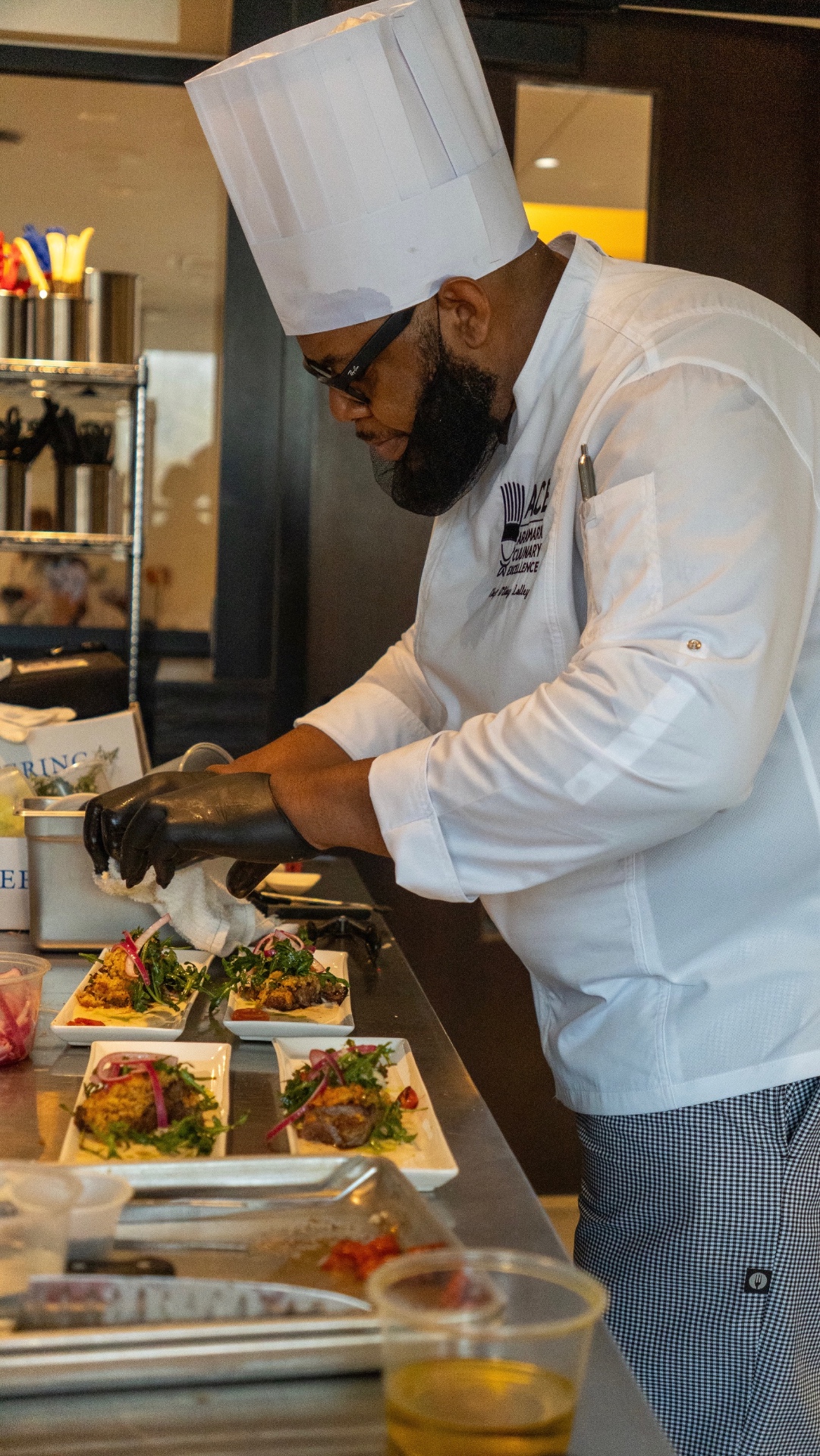 Chef O. plating in the kitchen