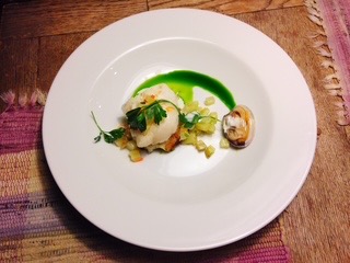 Plated scallop with apple and herb oil